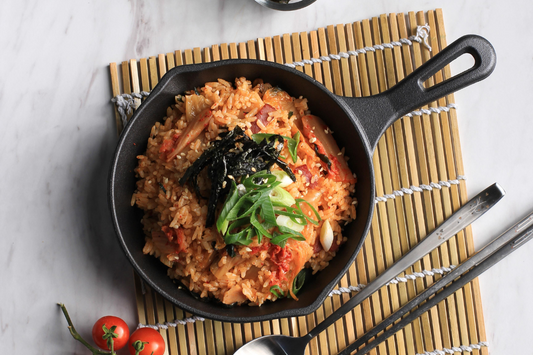 Steaming pot of homemade kimchi fried rice.