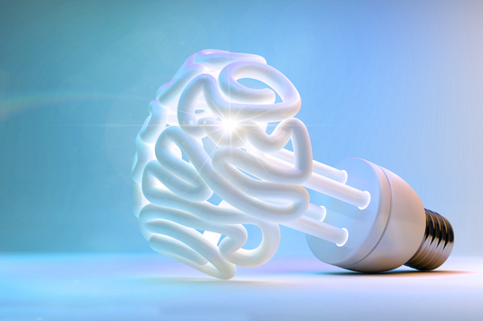 A lightbulb shaped like a human brain, glowing with a blue and white gradient background, symbolizing creativity and brainpower.