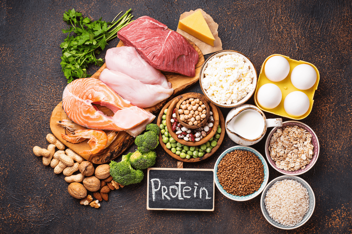 Assorted protein-rich foods including meat, fish, eggs, and dairy.