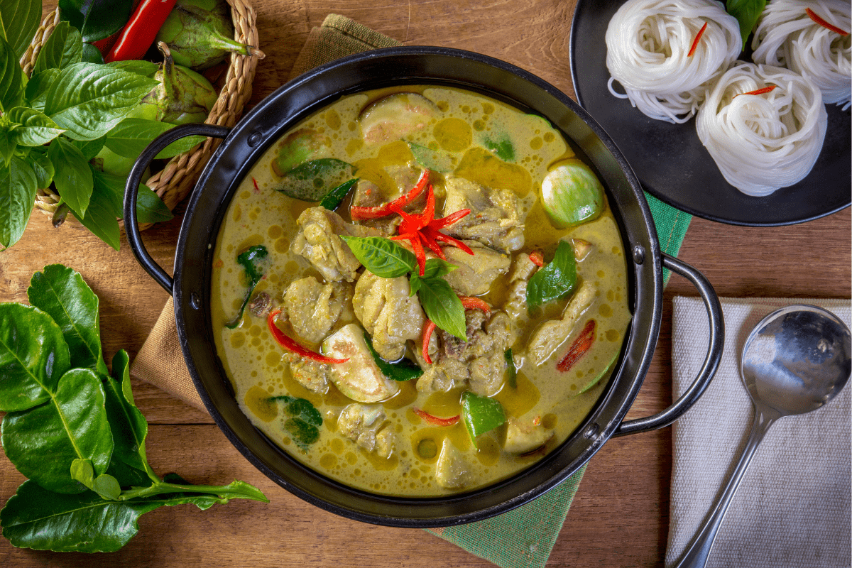 Thai green curry with chicken, vegetables, and rice noodles.